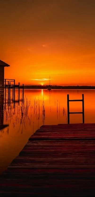 Serene sunset over a tranquil lake with a wooden dock.