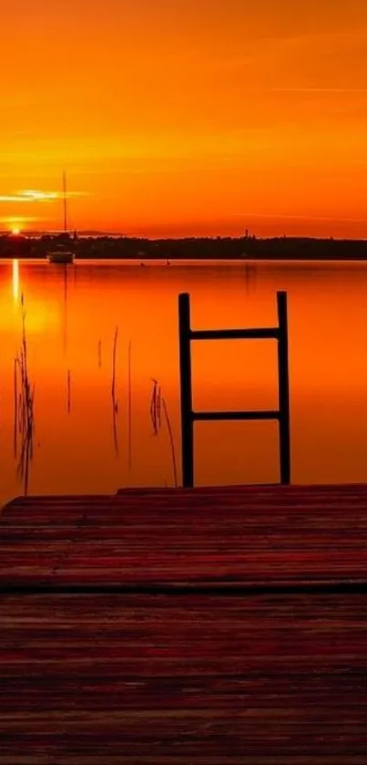 Serene sunset over lake with orange sky.