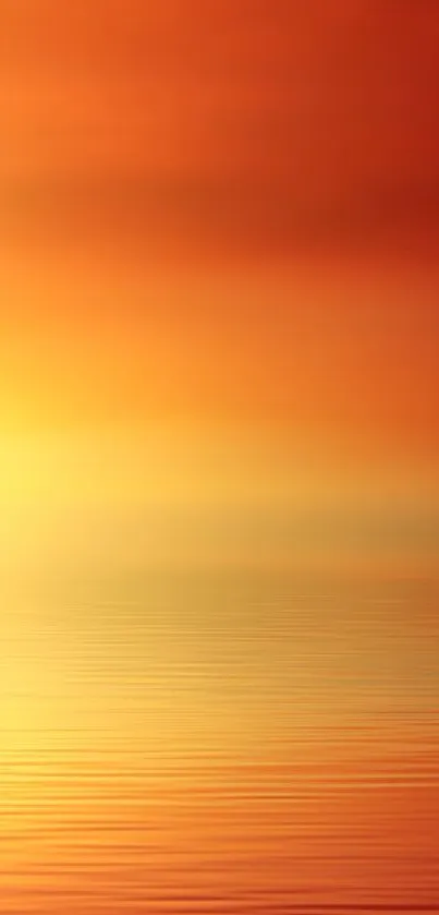 Sunset over calm water with orange and yellow gradient.