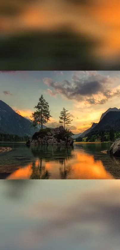 Breathtaking sunset over a mountain lake with glowing sky and calm waters.