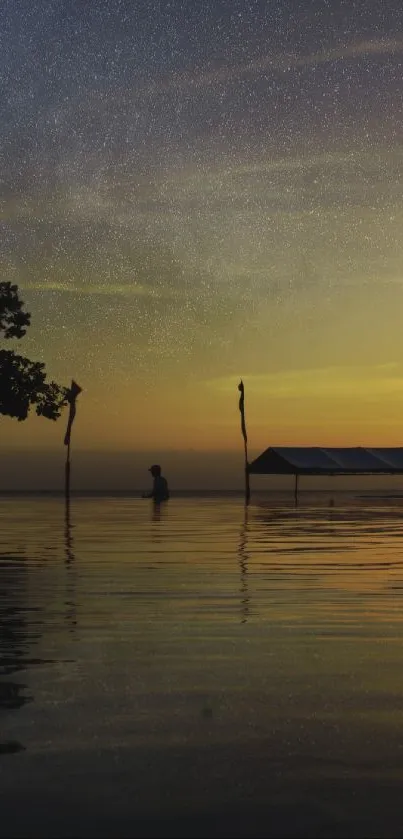 Serene sunset reflecting over calm waters with a silhouette in view.