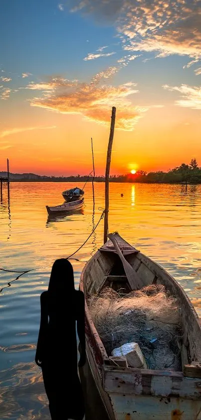 Silhouetted boat on a tranquil lake at sunset with vibrant orange hues.