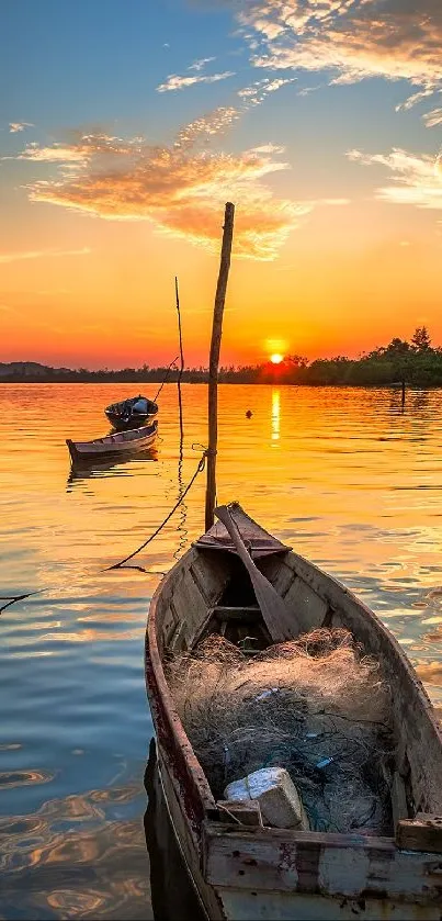 Serene sunset over water with boats and an orange sky.