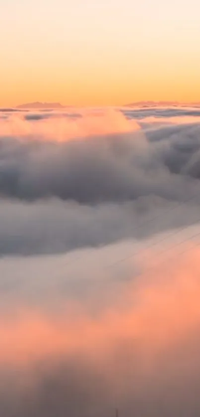 Beautiful sunset view over fluffy clouds with a pastel glow.