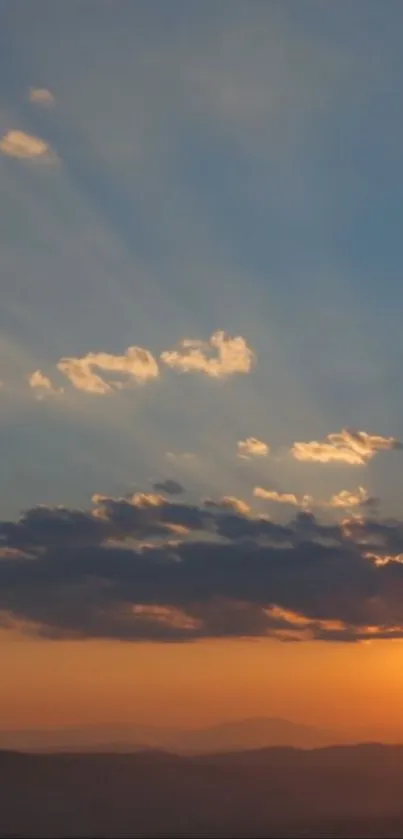 Sunset over mountains with vibrant sky