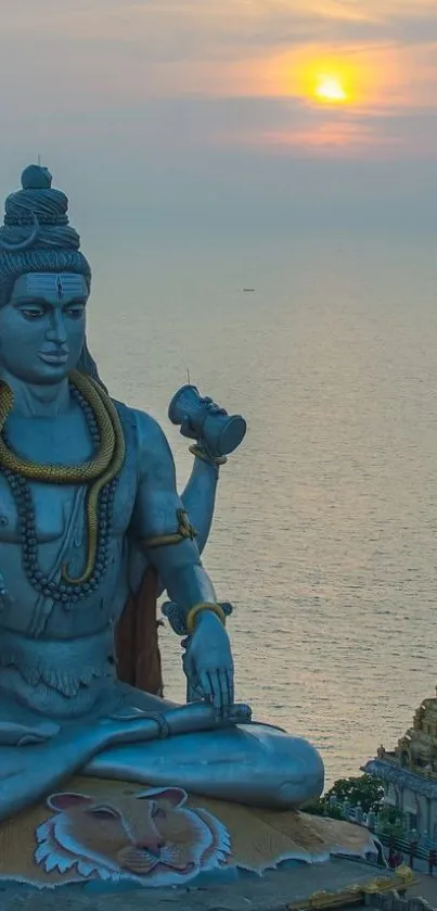 Majestic Shiva statue at ocean sunset.