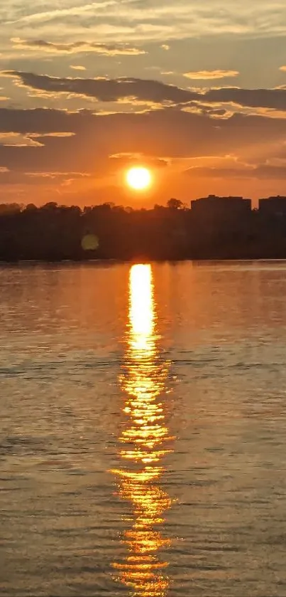 Beautiful sunset over calm water with golden reflections.