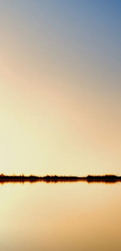 Golden sunset reflecting over calm water, creating a peaceful, serene scene.