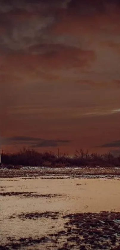 Serene landscape of sunset over water with lighthouse.