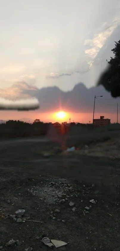 Serene sunset view over a road with a calm landscape.