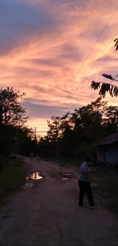 A tranquil rural pathway under a beautiful sunset sky.