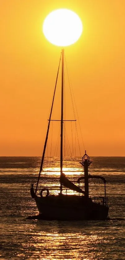 Sailboat silhouette at sunset on an orange horizon.