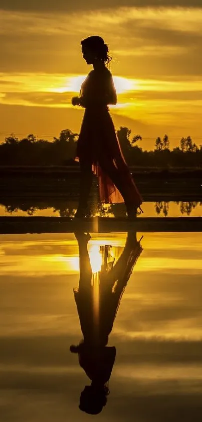 A silhouetted figure at sunset with golden reflection over water.