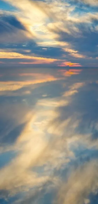 Serene sunset sky reflecting on water.