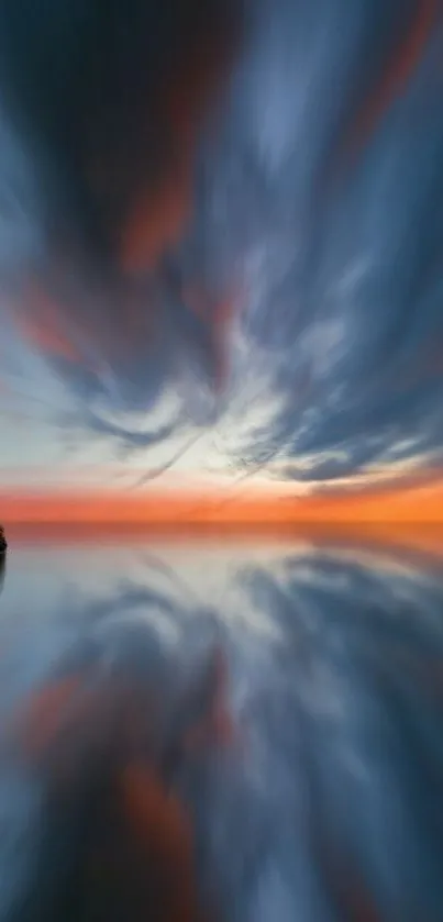 Dramatic sunset sky reflected in calm waters, with vibrant colors and clouds.