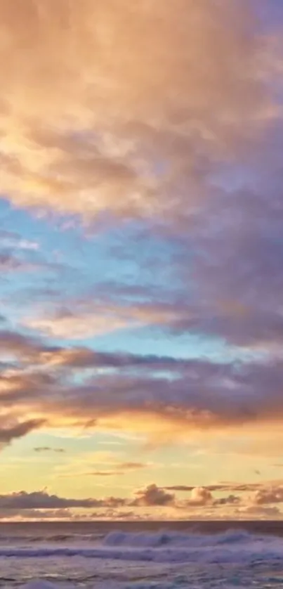 Vibrant sunset with orange, pink, and blue sky over a calm ocean.