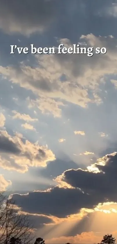 Serene sunset with clouds and sun rays lighting up the sky.