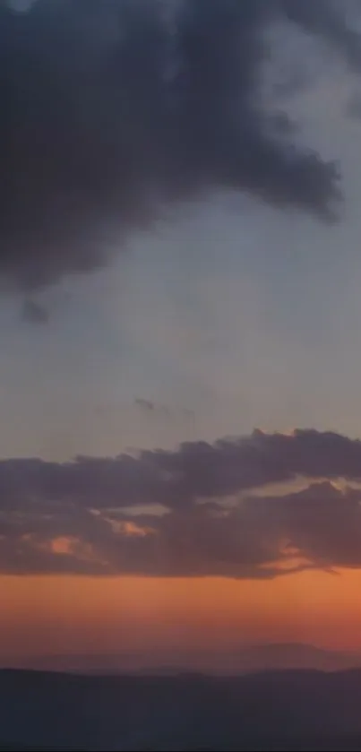 Tranquil sunset with dramatic clouds.