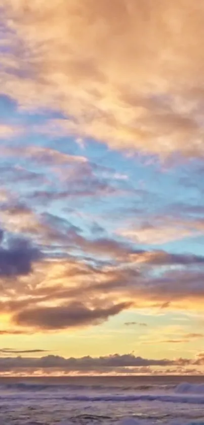 Vibrant sunset sky with ocean and clouds.