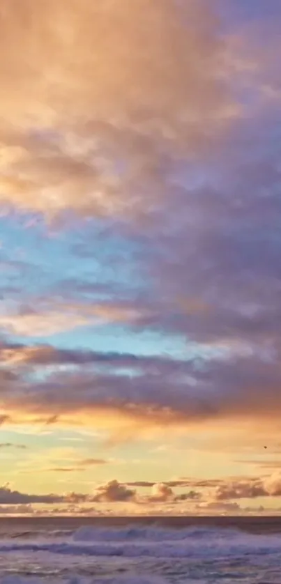 Vibrant sunset sky over calm ocean waves.