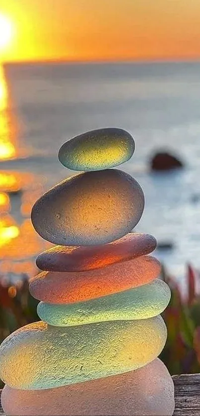 Stacked stones with ocean sunset and warm colors.