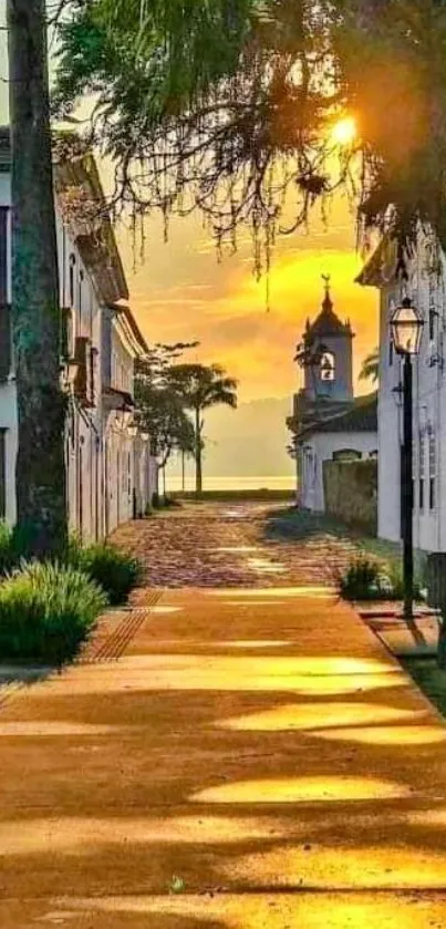 Village street at sunset with golden hues and charming architecture.