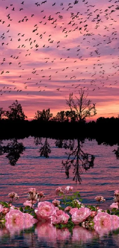 Pink sunset over ocean with birds and flowers reflecting.