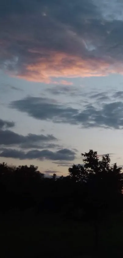 Calm evening sunset with dark clouds.