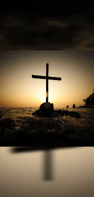 Silhouette of a cross at sunset over calm waters.