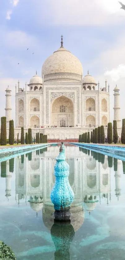 Reflection of Taj Mahal with a serene sky and lush greenery.