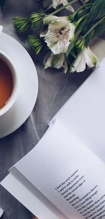 Cup of tea with flowers and book on a serene background.