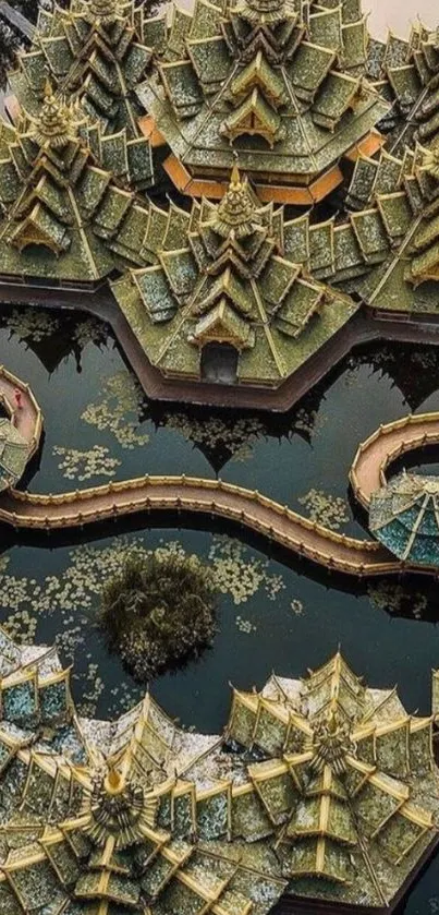 Aerial view of intricate temple architecture with golden domes over water.