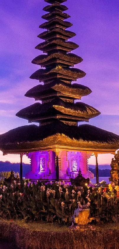 Serene temple at sunset with a vibrant purple sky.