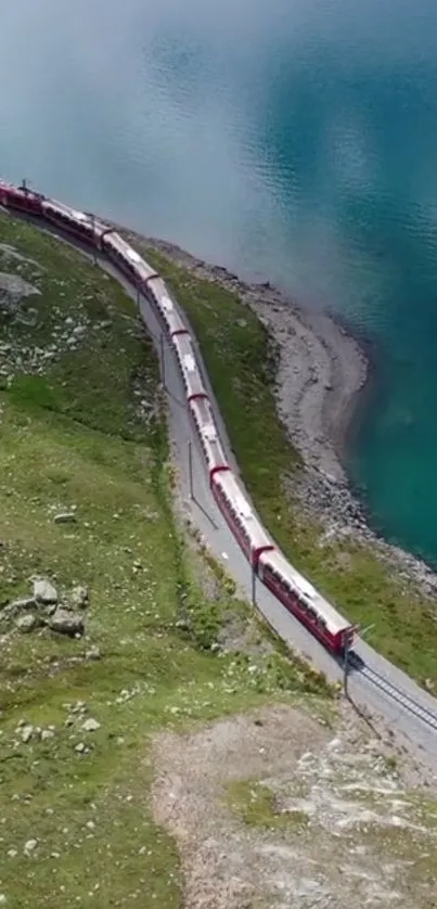 Scenic train along a vibrant blue lake with lush green landscapes.