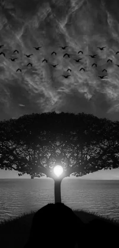 Serene black and white wallpaper with tree silhouette and birds.