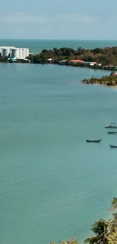 Serene tropical beach with boats and azure water.