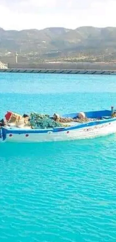 A lone boat on a bright turquoise sea with mountains in the background.