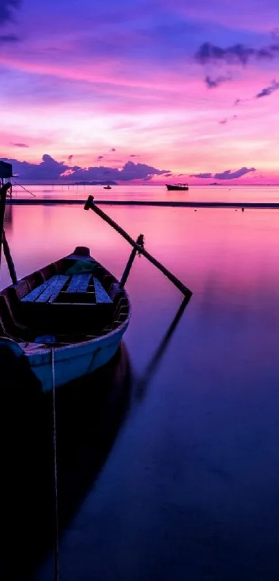 Twilight scene with boat, purple sunset and calm water reflection.