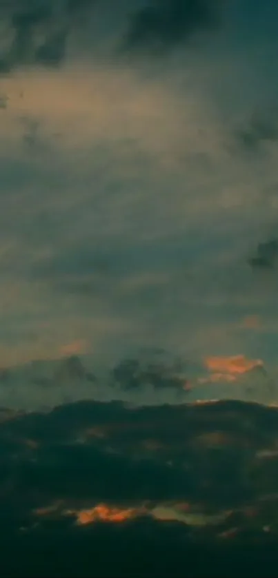 Dark twilight sky with clouds and an evening glow.