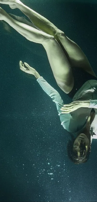 Elegant diver in serene blue underwater setting.