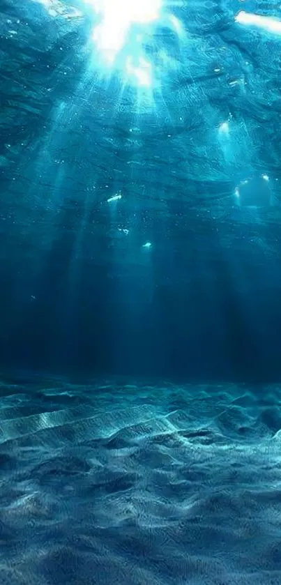 Underwater ocean scene with blue light rays.