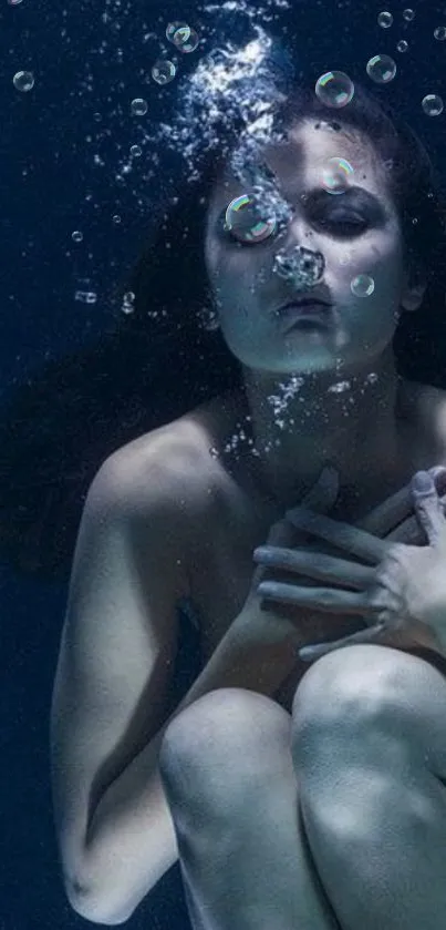 Woman underwater in serene, deep blue setting.