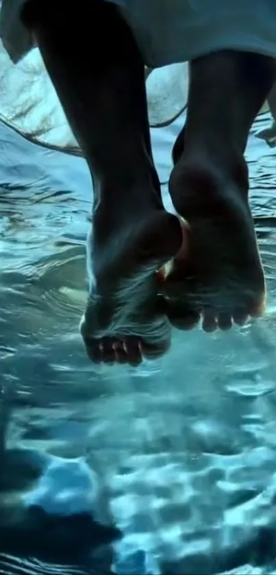 Feet dipping into tranquil blue water.