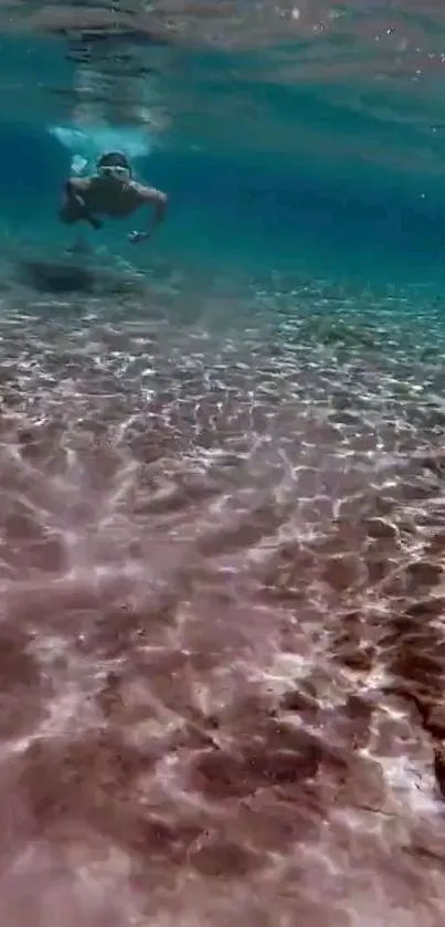 Underwater swimmer amidst sunlit ocean ripples in serene turquoise setting.