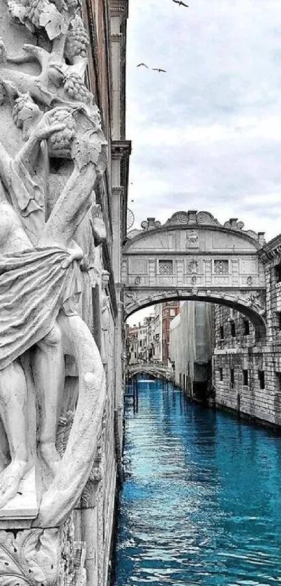 Venice canal with stone carvings and bridge, serene cityscape wallpaper.