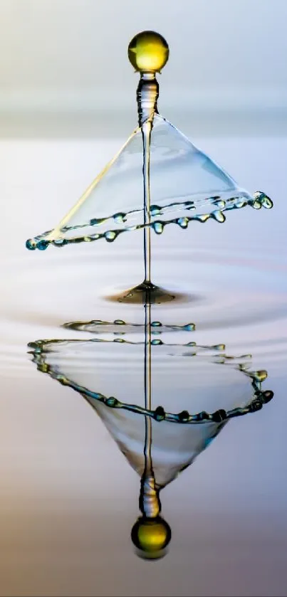 Artistic water drop creating a reflection.