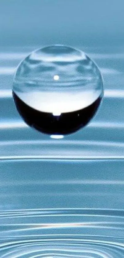 Floating water droplet with ripples in calming blue tones.