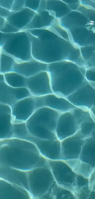 Rippling water with blue reflection wallpaper.
