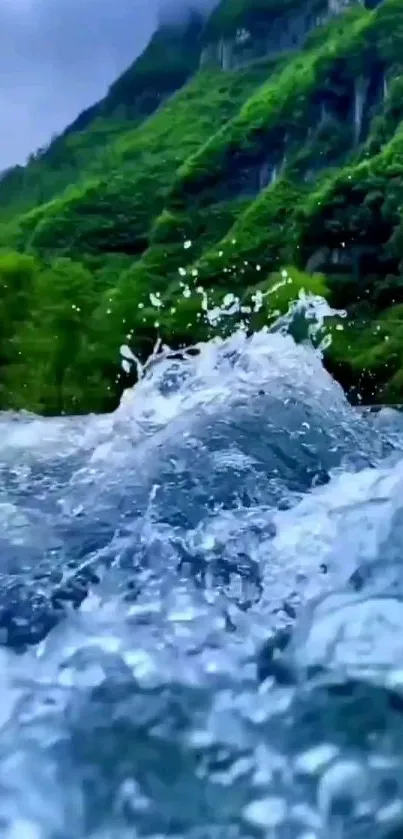 Vibrant waterfall with lush greenery and mountains