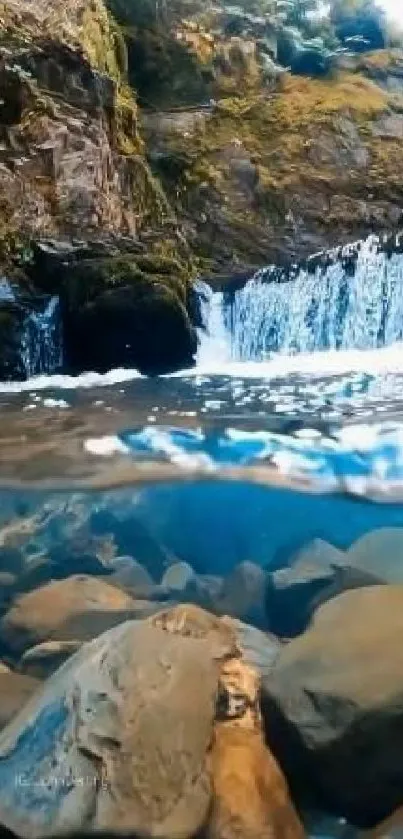 Tranquil waterfall with mossy rocks and clear blue water.